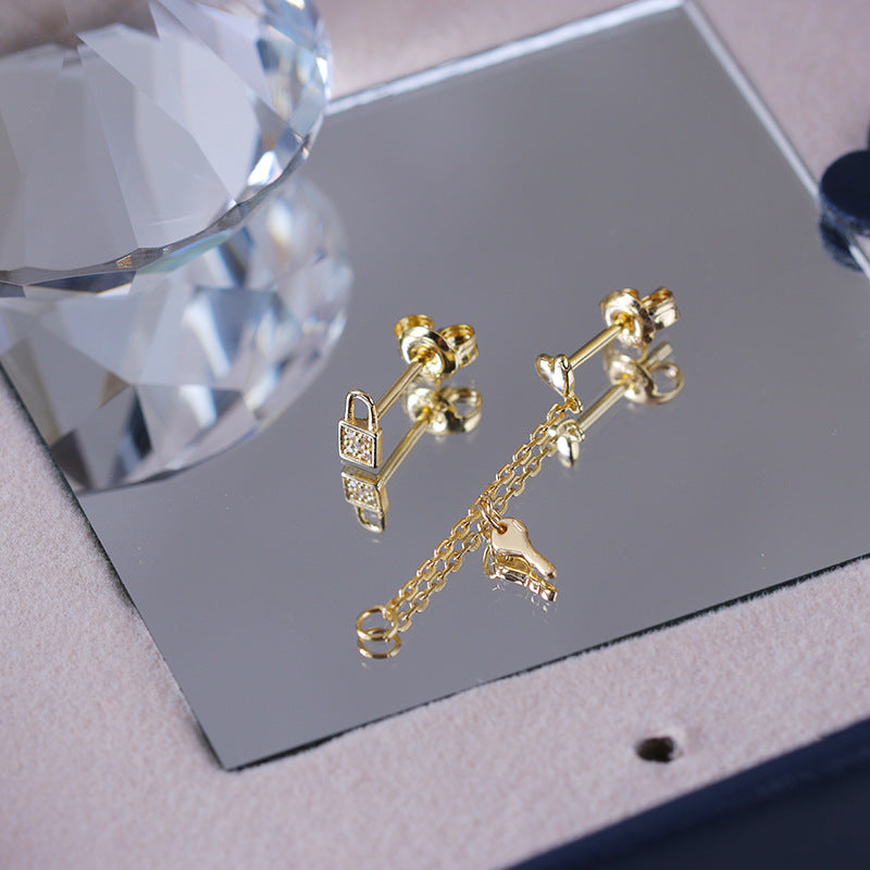 Lock asymmetric earrings